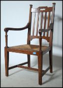 A Victorian Arts & Crafts rattan weave carver armchair in the manner of Liberty. The chair being