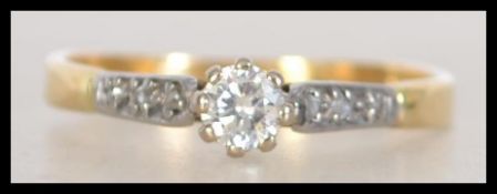 A marked 18ct solitaire diamond ring with diamond