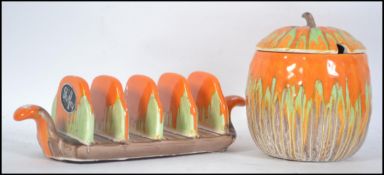 A 1930's Art Deco Shelley China conserve pot with lid and matching toast rack in a drip glaze