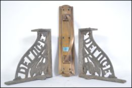 A vintage 20th century reclaimed large brass door handle 38cm tall together with a pair of 19th