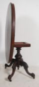 A 19th century Victorian tilt top walnut oval loo