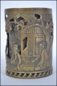 A Chinese double skin cast bronze brush pot Worked with figures  mountain river landscape, with