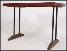 A retro 1970's French formica and metal dining table. The unusual retro table raised on an