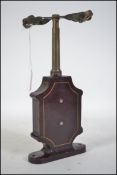 A 19th century German patented manual centrifuge test tube instrument with cast metal body in