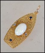 An unusual 18ct gold opal, sapphire and diamond ne