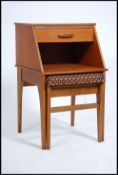 A 1970's retro teak wood Mr Chippy telephone table