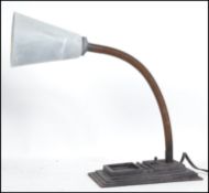An early 20th century industrial goose neck lamp w
