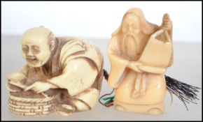 A bone Netsuke of an elder together with another,