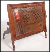 A Regency mahogany easel back dressing mirror having a square framed mirror supported on easel