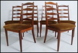 A set of six retro 1970's G Plan teak dining chairs with ladder back solid teak design a