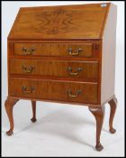 A vintage mid 20th century walnut bureau. having f