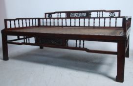 A large 19th century Chinese - Asitatic hardwood day bed - opium sofa. The back with panels