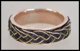 A 15ct gold Victorian band ring set with a filigree and elephant hair plat. Size.T.5.  Total