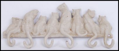 A vintage style, 20th century white cats key rack. Measures 35cms wide.