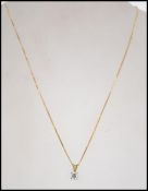 A hallmarked 18ct gold and diamond pendant necklace