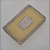 A 19th century silver and gilt metal pill box / snuff tin in the form of a book. The silver spine