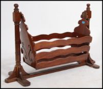 A vintage mid 20th century child's oak dolls play