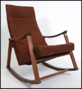 A vintage mid century Danish / Scandinavian teak wood rocking chair of angular form with padded seat