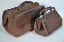 Two early to mid 20th century leather Gladstone ba