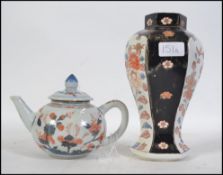 A Chinese Imari teapot complete with the lid having foliate decoration together with a hexagonal