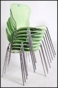 A set of eight Fritz Hanson style series chairs by Frovi. Plastic lime green shaped seat frames