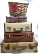 A vintage stack of suitcases to include a naval D - Mob case, a good leather case, a small leather