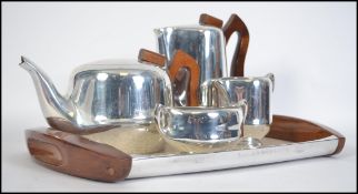 A retro 20th century Piquot Ware five piece tea and coffee service consisting of teapot, coffee pot,