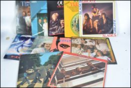 A collection of vinyl long play LP's to include The Beatles, Marc Bolan, Haircut 100, Queen, Ian