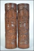 2 large 20th century Chinese bamboo brush pots of cylindrical form being carved in relief with