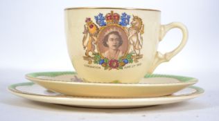 A Clarice Cliff ceramic trio for the Coronation of the Queen 1953 having pictorial crest with