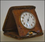 An early 20th century Asprey of London Goliath travel clock set within a crocodile skin case. The