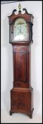 A Late 18th early 19th Century oak and mahogany longcase clock. The case with a twin swan neck