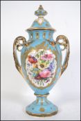 A Victorian ceramic twin handles vase - amphora in the manner of Meissen. The vase with blue