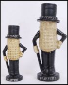 Two vintage style, 20th century money banks of Mr Peanut. The tallest measures 25cms.