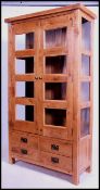 A contemporary solid chunky oak glazed display cabinet bookcase. Having two long glazed doors with