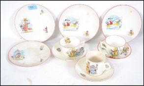 A collection of children's ceramics / cups & saucers to include Huckleberry Hound, Yogi Bear and