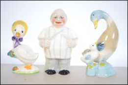 A collection of three vintage ceramic figurines to