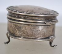 A silver hallmarked pill pot having a hinged lid r
