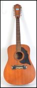 A Framus 12 string acoustic Guitar No 76a with Framus atop and applied label to the centre.