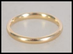 A hallmarked 9ct gold band ring . Size P.5. Weight 2.7g. .