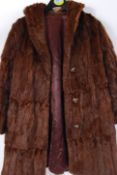 A vintage 20th century ladies three quarter length fur coat in a medium brown  colour. ( Approx size