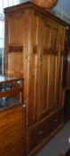 A Victorian pine Arts & Crafts wardrobe raised on