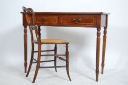 A Regency style mahogany console table having a pair of drawers to the front raised on reeded column
