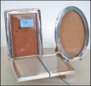 A collection of 3 silver hallmarked picture frames