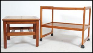 A retro 20th century teak tiled drinks trolley together with a Danish inspired teak tiled topped