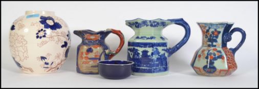 A collection of vintage ceramics to include Ironstone jugs, Mason jar and other items please see