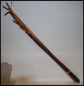A collection of four 20th century thumb sticks one with antler horn atop please see images.