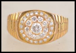 A gold and diamond ring with central 20 pt diamond
