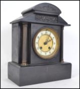 Am Edwardian Slate and Marble mantle clock having gilded columns  with 8 day movement, gilt enamel