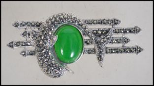 A pretty ladies silver, marcasite and jade dolphin